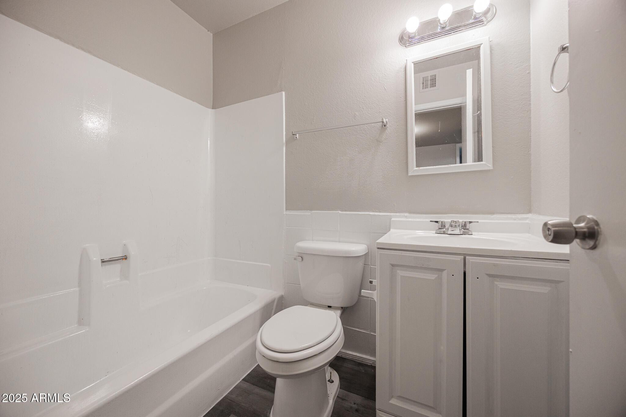 1703 West Mountain View Road, Unit 14 Phoenix, AZ 85021 - Photo 14 of 14 a bathroom with a sink toilet and shower