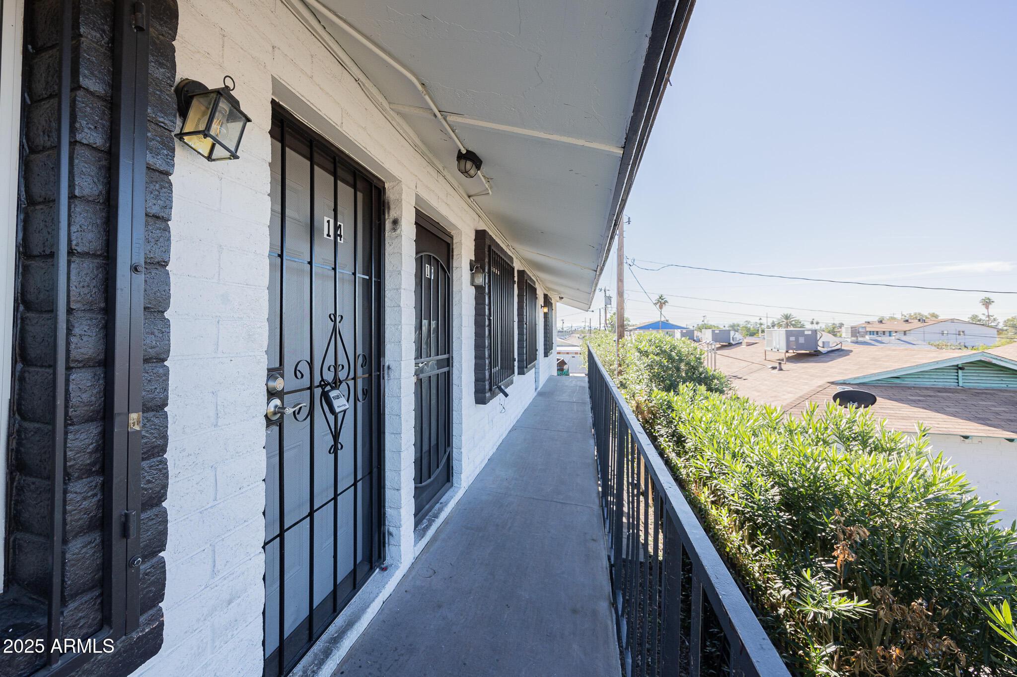 1703 West Mountain View Road, Unit 14 Phoenix, AZ 85021 - Photo 2 of 14 a stair with table and potted plants