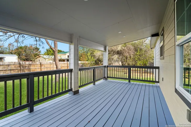 a view of a wooden balcony with wooden floor