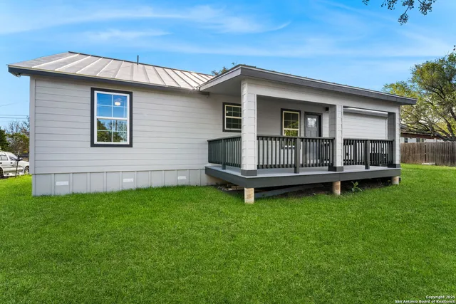 a view of backyard with deck