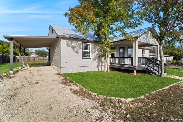 front view of a house with a small yard