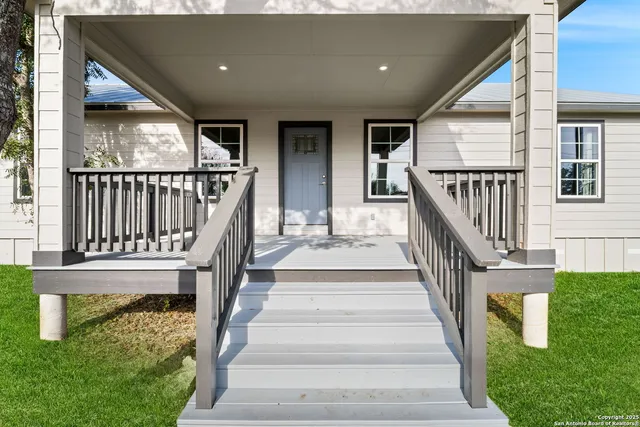 a view of staircase with lots of frames and garden view