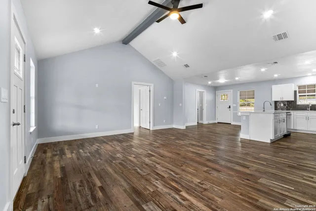 a view of kitchen and hall with wooden floor