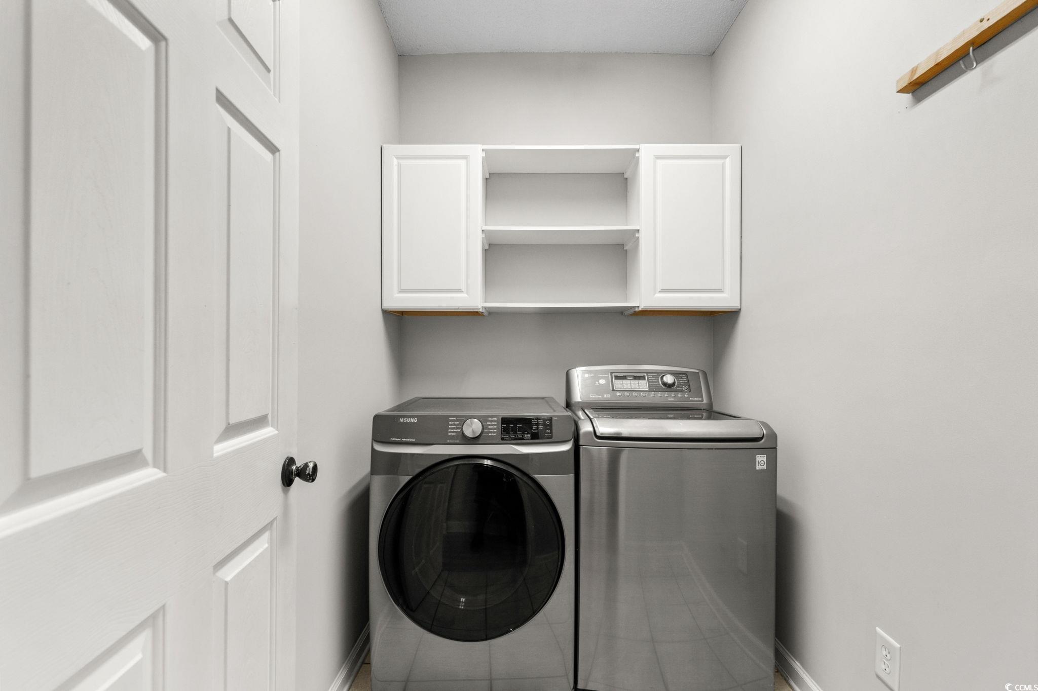 2723 Canvasback Trail Myrtle Beach, SC 29588 - Photo 27 of 40 Washroom with cabinet space and independent washer and dryer
