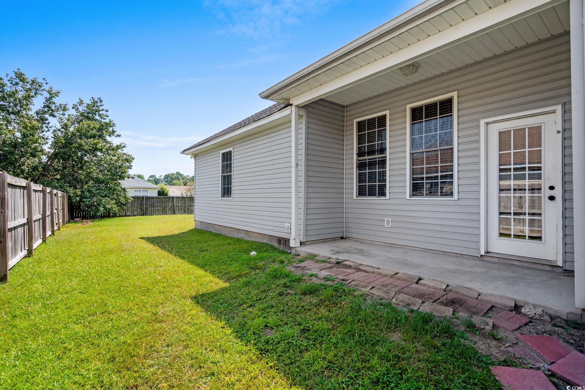 2723 Canvasback Trail Myrtle Beach, SC 29588 - Photo 29 of 40 Fenced backyard with a patio area