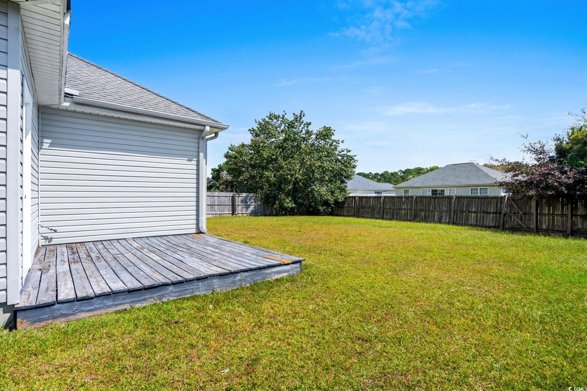 2723 Canvasback Trail Myrtle Beach, SC 29588 - Photo 30 of 40 Fenced backyard with a deck