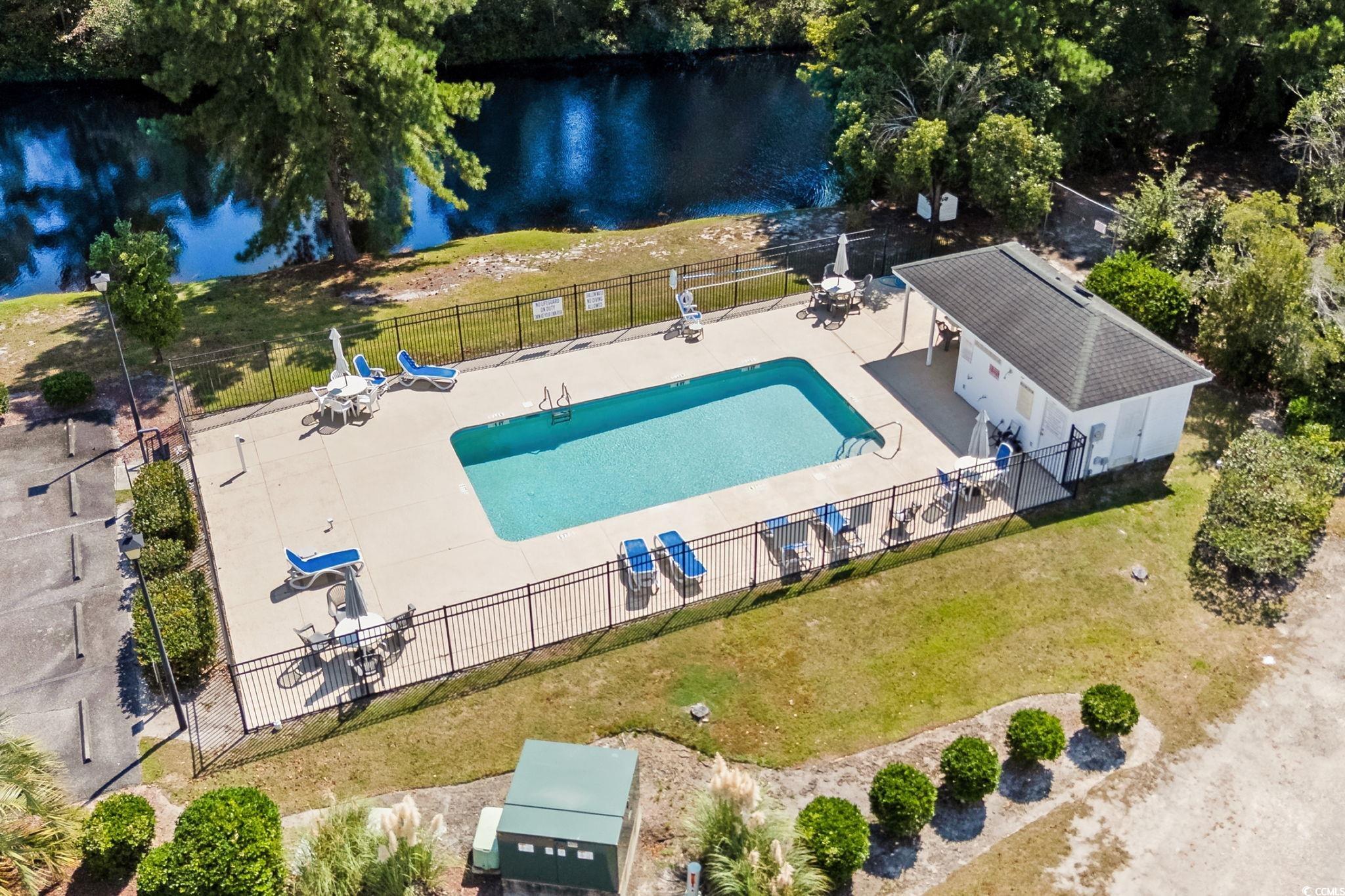 2723 Canvasback Trail Myrtle Beach, SC 29588 - Photo 37 of 40 Bird's eye view of a pool and a large body of water