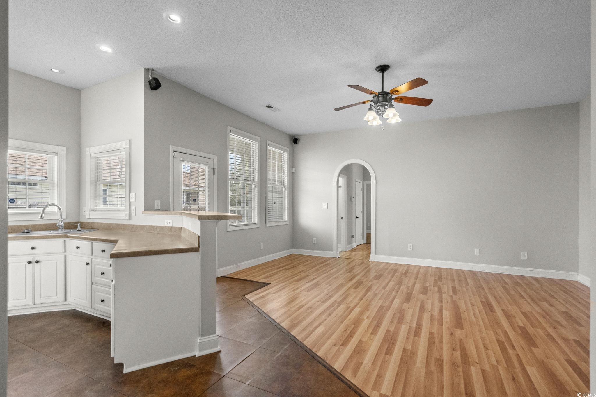 2723 Canvasback Trail Myrtle Beach, SC 29588 - Photo 40 of 40 Kitchen featuring a textured ceiling, white cabinets, ceiling fan, open floor plan, and recessed lighting