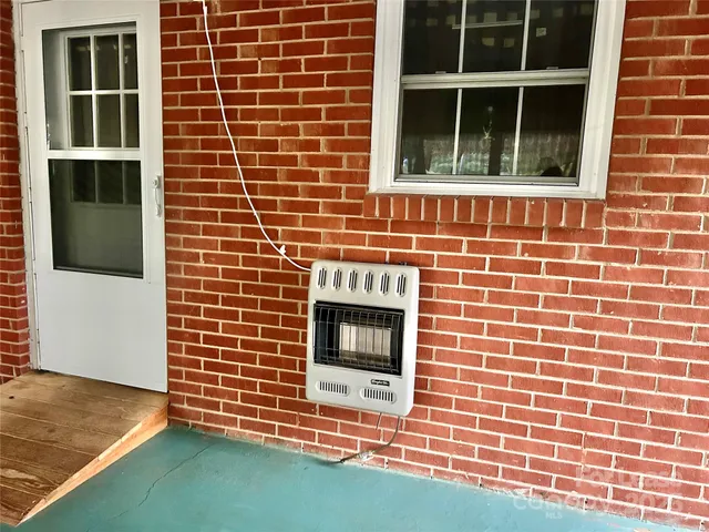 an empty room with large windows