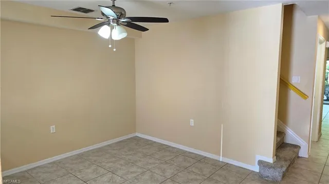 a view of a chandelier fan in a room