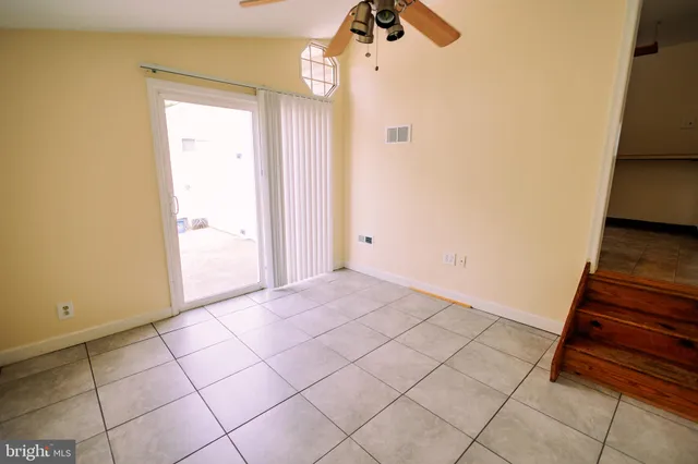 a view of an empty room and wooden floor