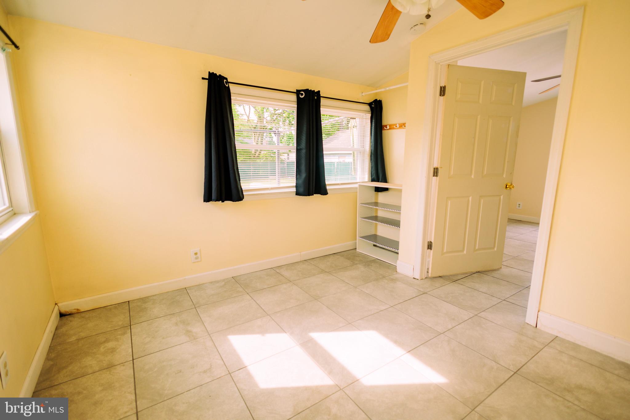 222 MacClelland Avenue Glassboro, NJ 08028 - Photo 17 of 37 a view of an empty room with window and bathroom