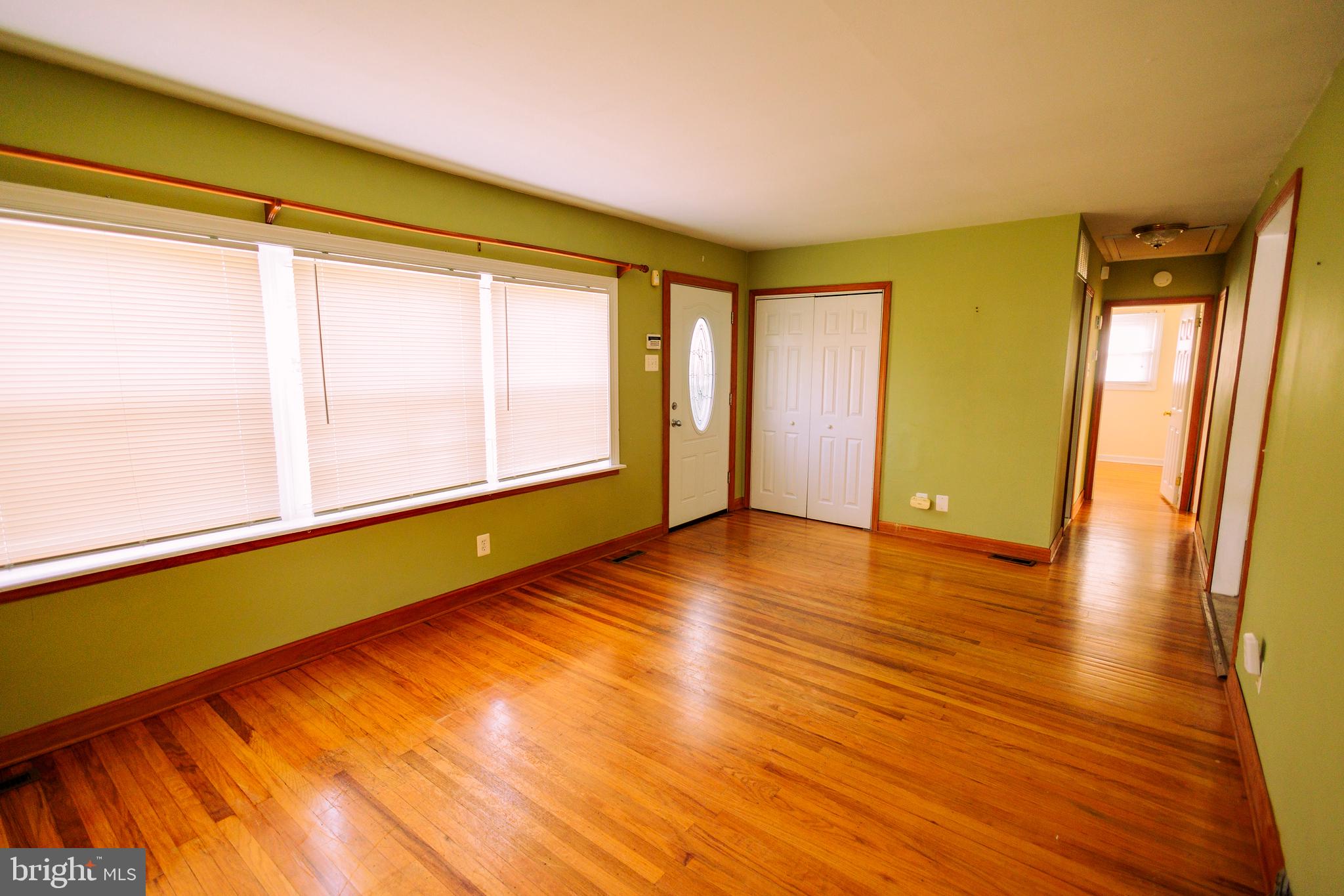222 MacClelland Avenue Glassboro, NJ 08028 - Photo 21 of 37 a view of an empty room with wooden floor and a window