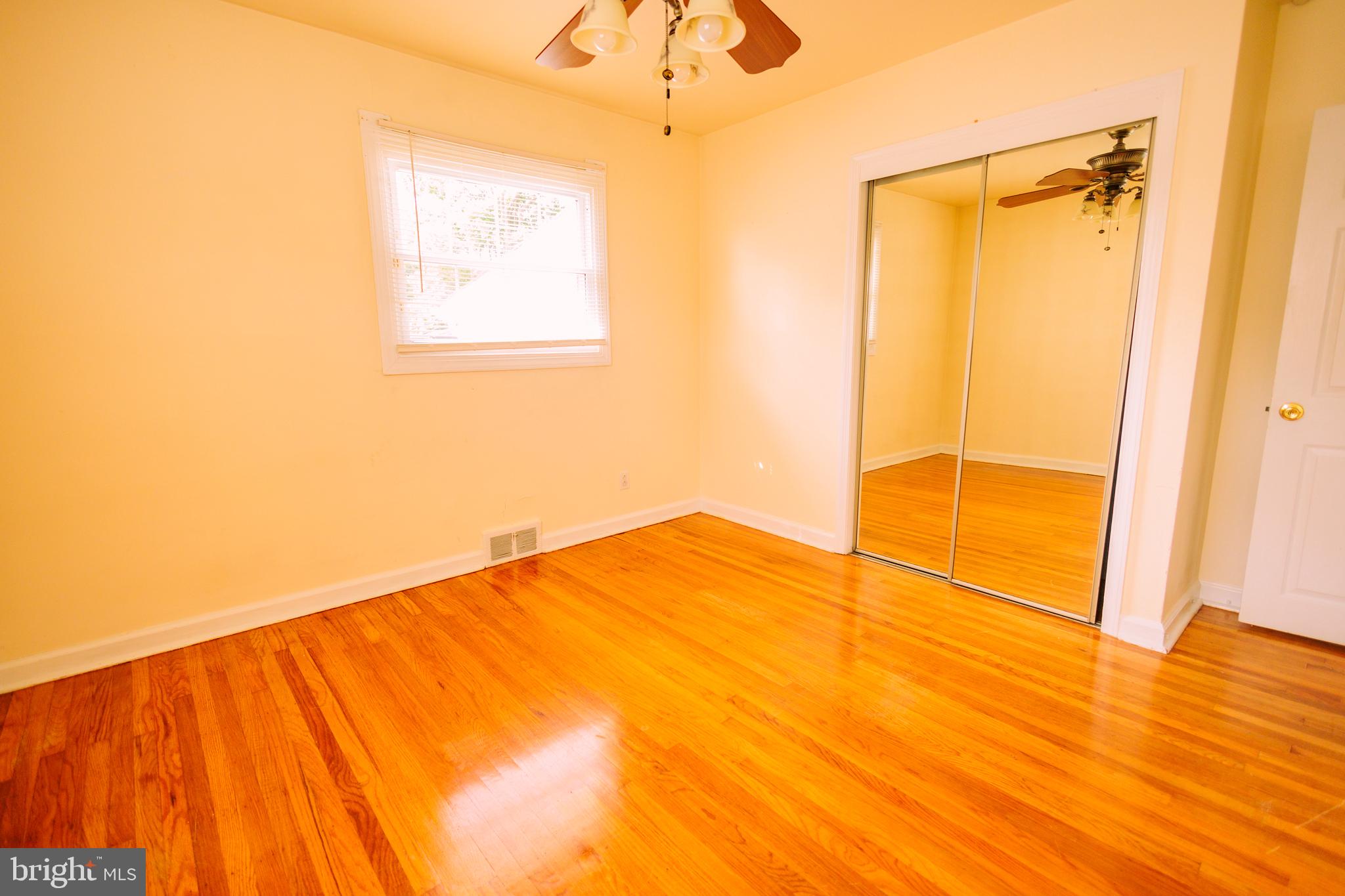 222 MacClelland Avenue Glassboro, NJ 08028 - Photo 25 of 37 a view of an empty room with wooden floor and a window