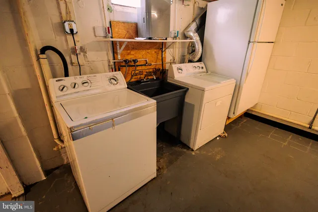a utility room with dryer and washer