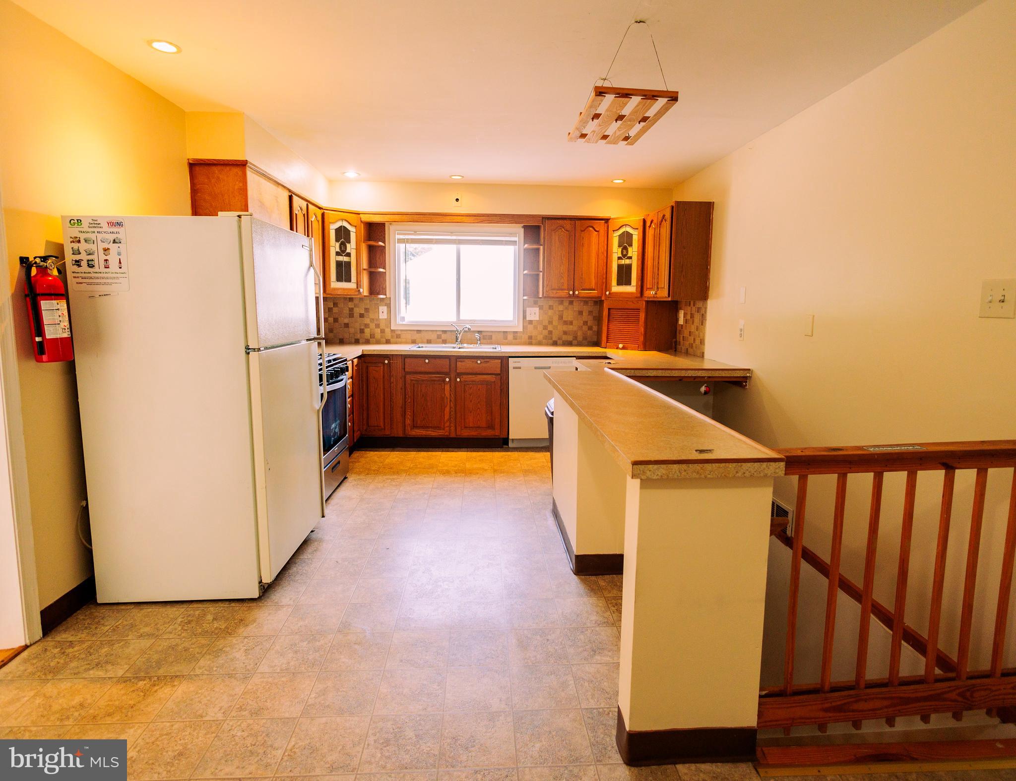 222 MacClelland Avenue Glassboro, NJ 08028 - Photo 9 of 37 a view of kitchen with furniture and a refrigerator