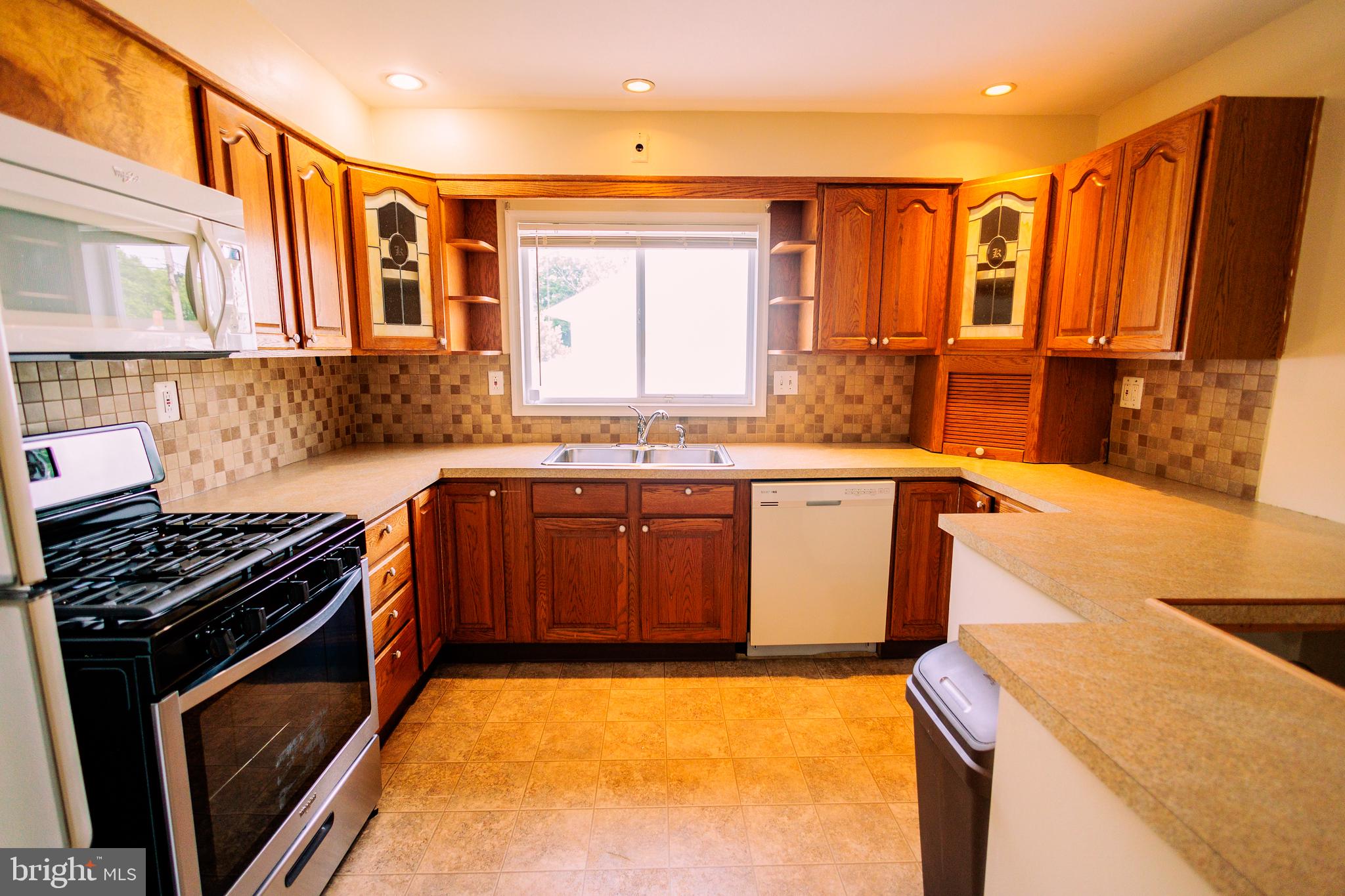 222 MacClelland Avenue Glassboro, NJ 08028 - Photo 10 of 37 a kitchen that has a sink and a stove