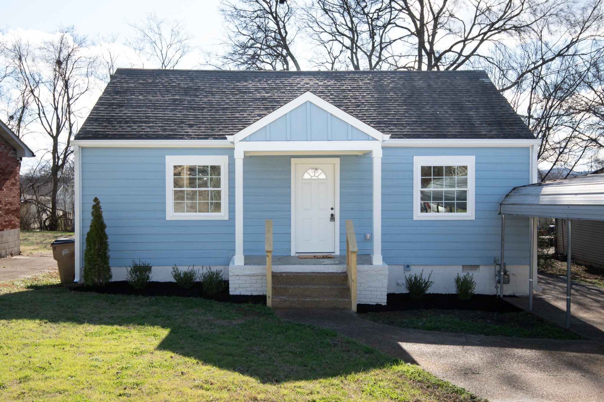 a front view of a house with garden