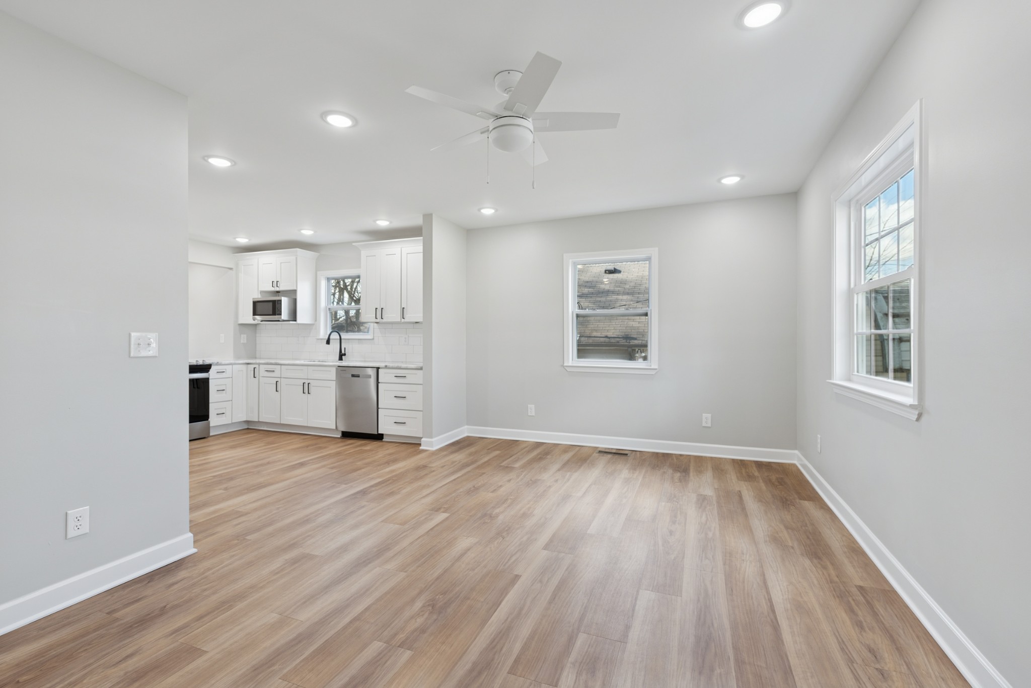 112 Wiley Street Madison, TN 37115 - Photo 13 of 43 a view of kitchen with wooden floor and window
