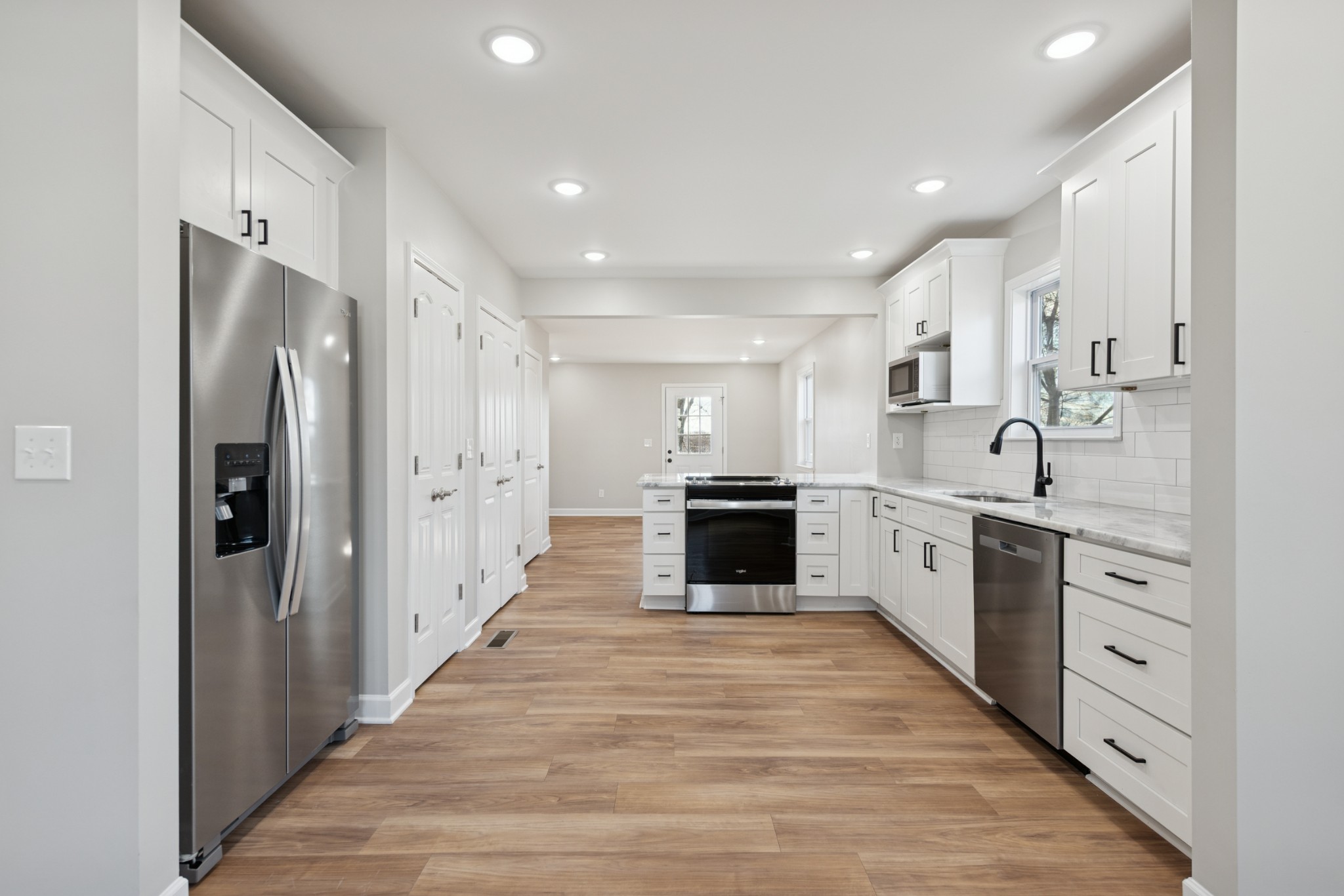 112 Wiley Street Madison, TN 37115 - Photo 14 of 43 a large kitchen with stainless steel appliances a refrigerator and a sink