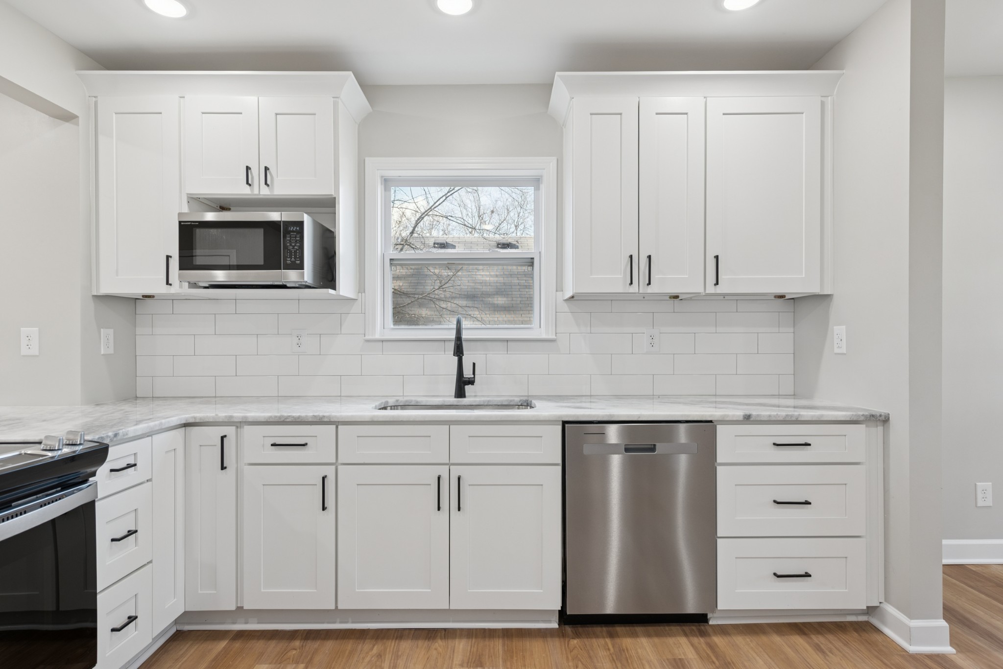 112 Wiley Street Madison, TN 37115 - Photo 16 of 43 a kitchen with white cabinets and sink