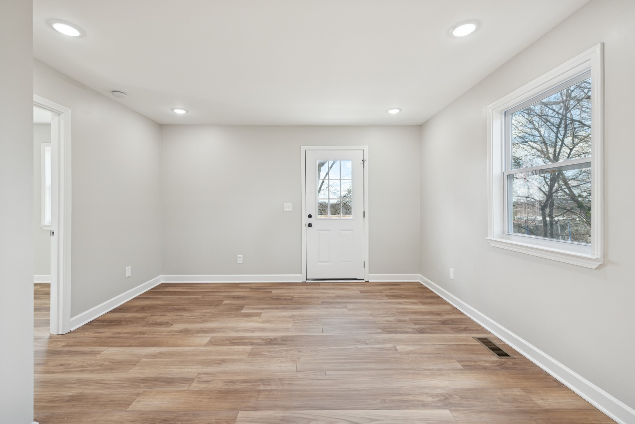 112 Wiley Street Madison, TN 37115 - Photo 20 of 43 a view of an empty room with wooden floor and window