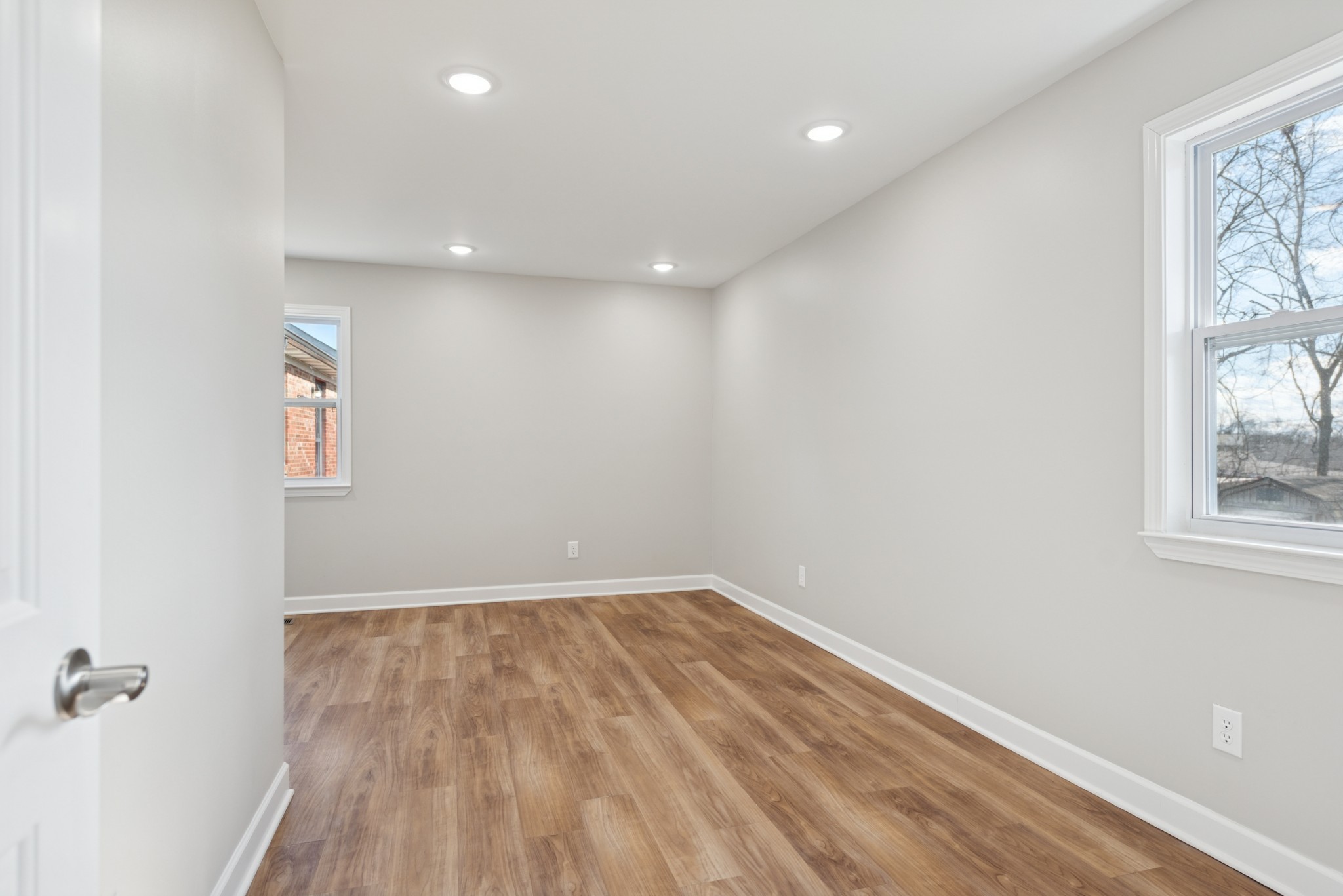 112 Wiley Street Madison, TN 37115 - Photo 25 of 43 an empty room with wooden floor and windows