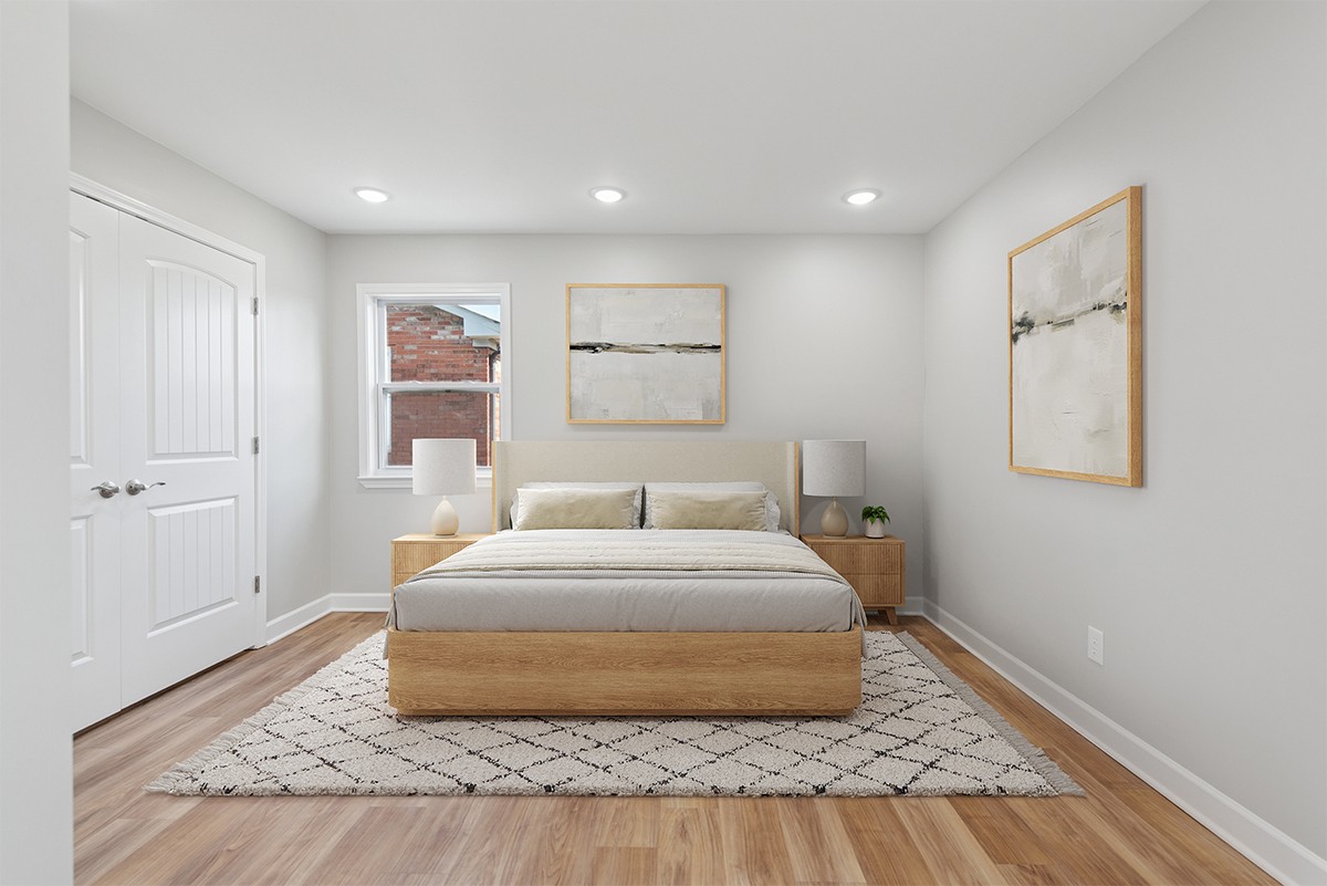 112 Wiley Street Madison, TN 37115 - Photo 27 of 43 a spacious bedroom with a bed and a painting on the wall
