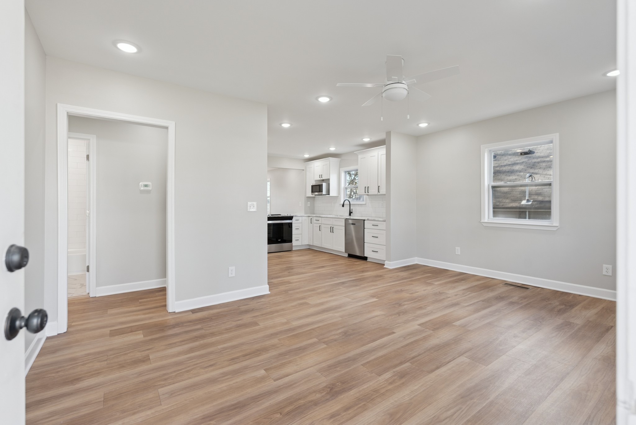 112 Wiley Street Madison, TN 37115 - Photo 8 of 43 an empty room with wooden floor and windows