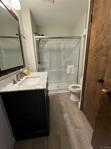 a bedroom with two beds and painting on the wall