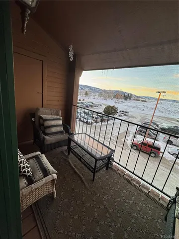 a view of a chairs and table in patio