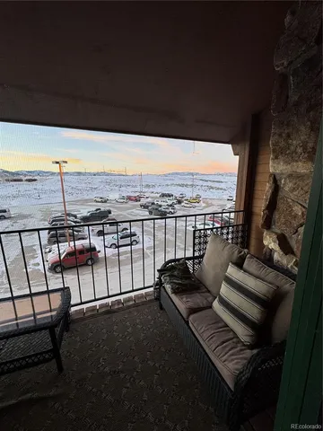 a bed room with large bed and wooden floor