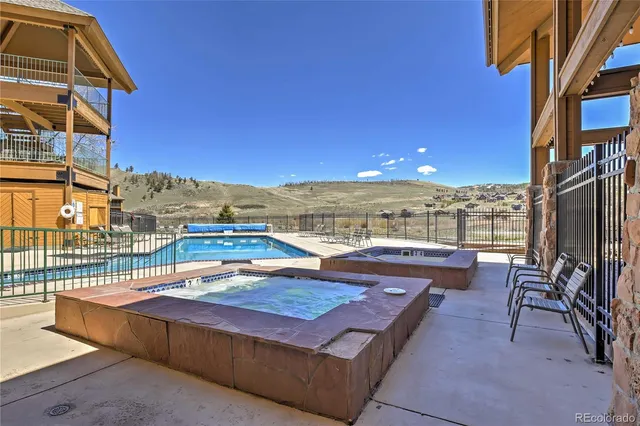 a view of a building with a tub and wooden floor