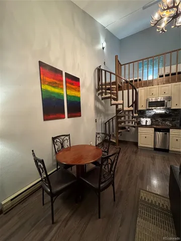 a kitchen with wooden cabinets and a stove top oven