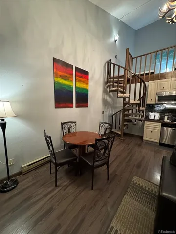 a view of entryway with livingroom and wooden floor