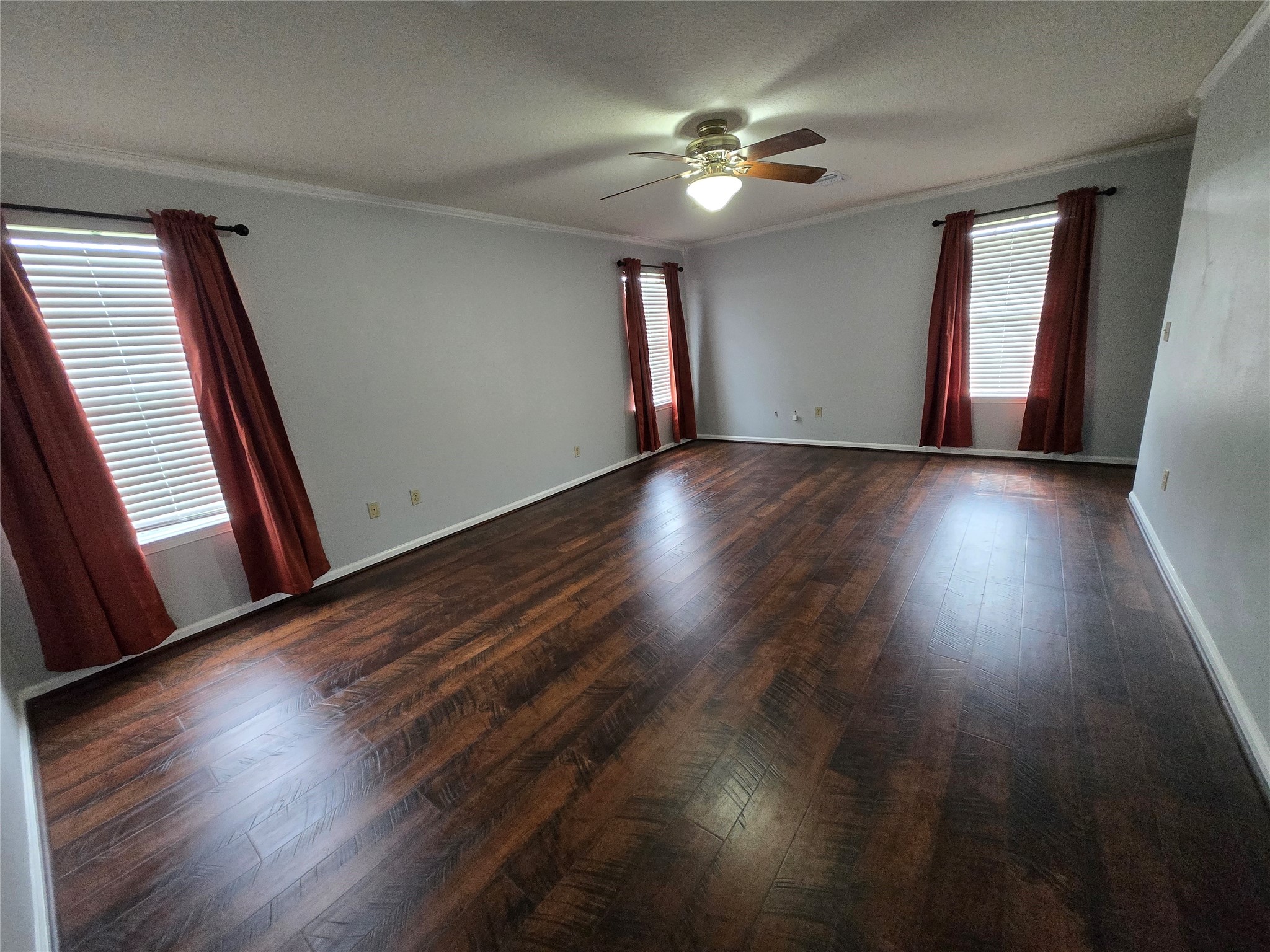 18010 County Road 48 Rosharon, TX 77583 - Photo 7 of 13 a view of an empty room with wooden floor and fan