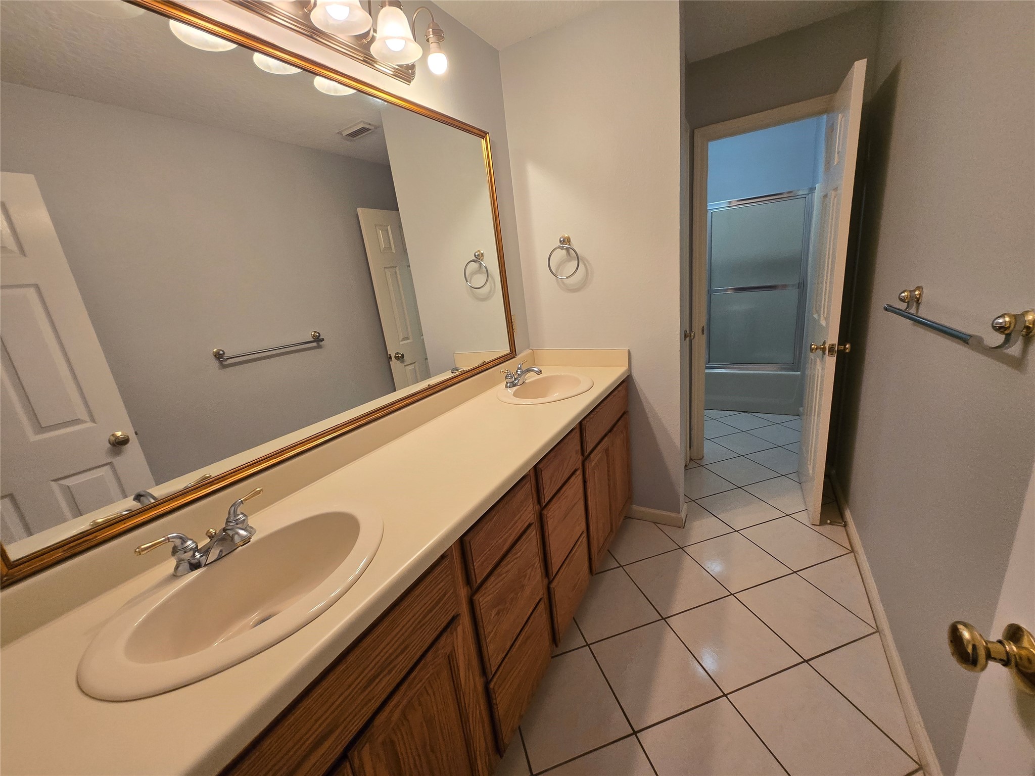 18010 County Road 48 Rosharon, TX 77583 - Photo 10 of 13 a bathroom with a sink a vanity and mirror