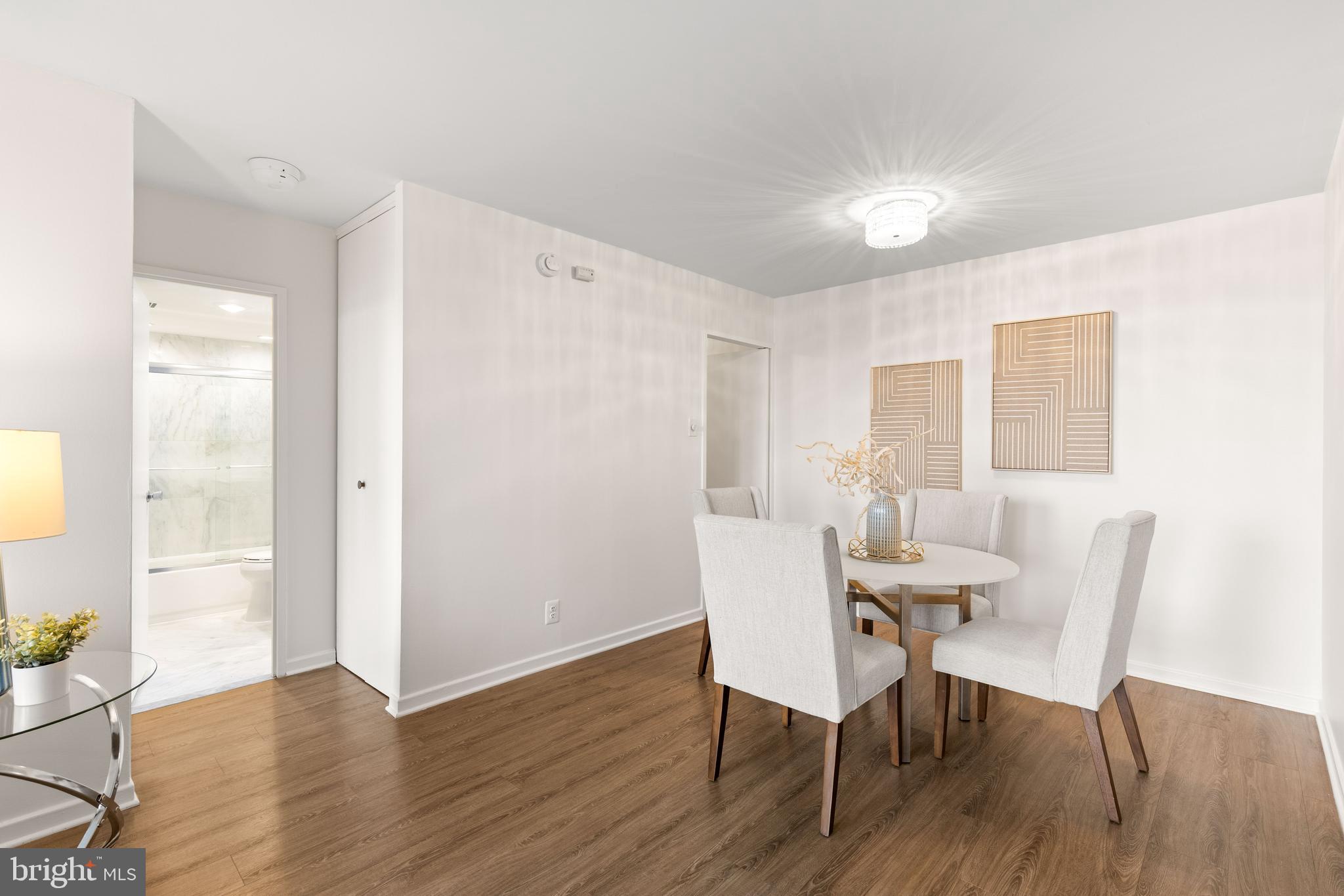 300 M Street Southwest, Unit N808 Washington, DC 20024 - Photo 11 of 36 a view of a dining room with furniture and wooden floor