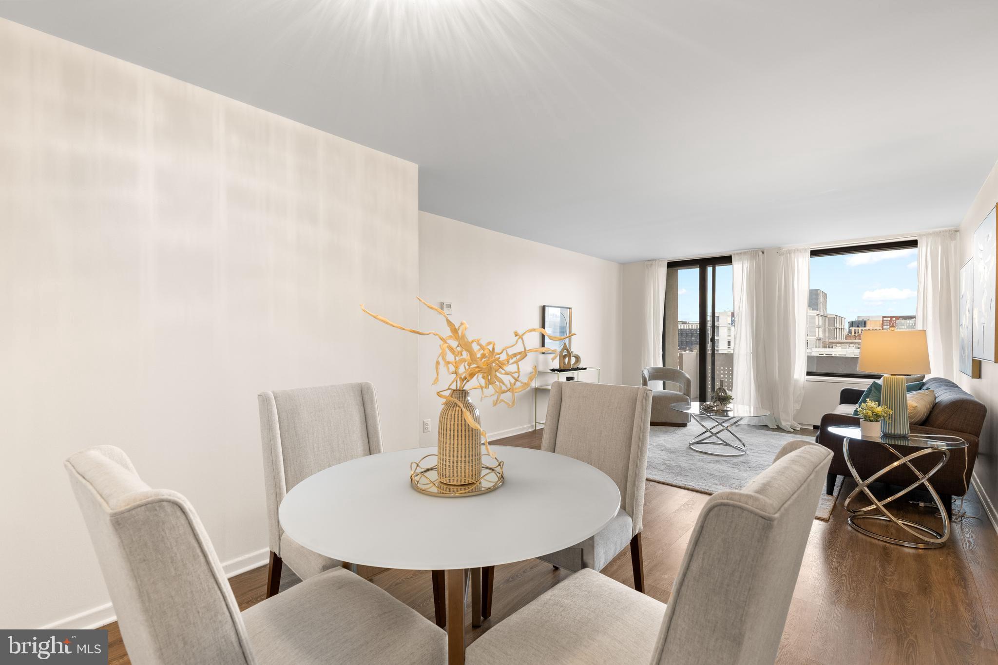 300 M Street Southwest, Unit N808 Washington, DC 20024 - Photo 12 of 36 a view of a dining room with furniture and wooden floor