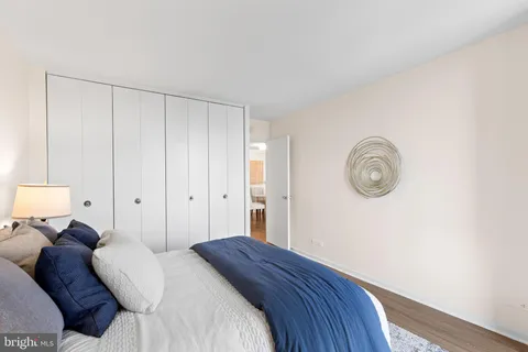 a bedroom with a bed and a closet