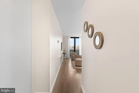 a view of a hallway with a washer and dryer