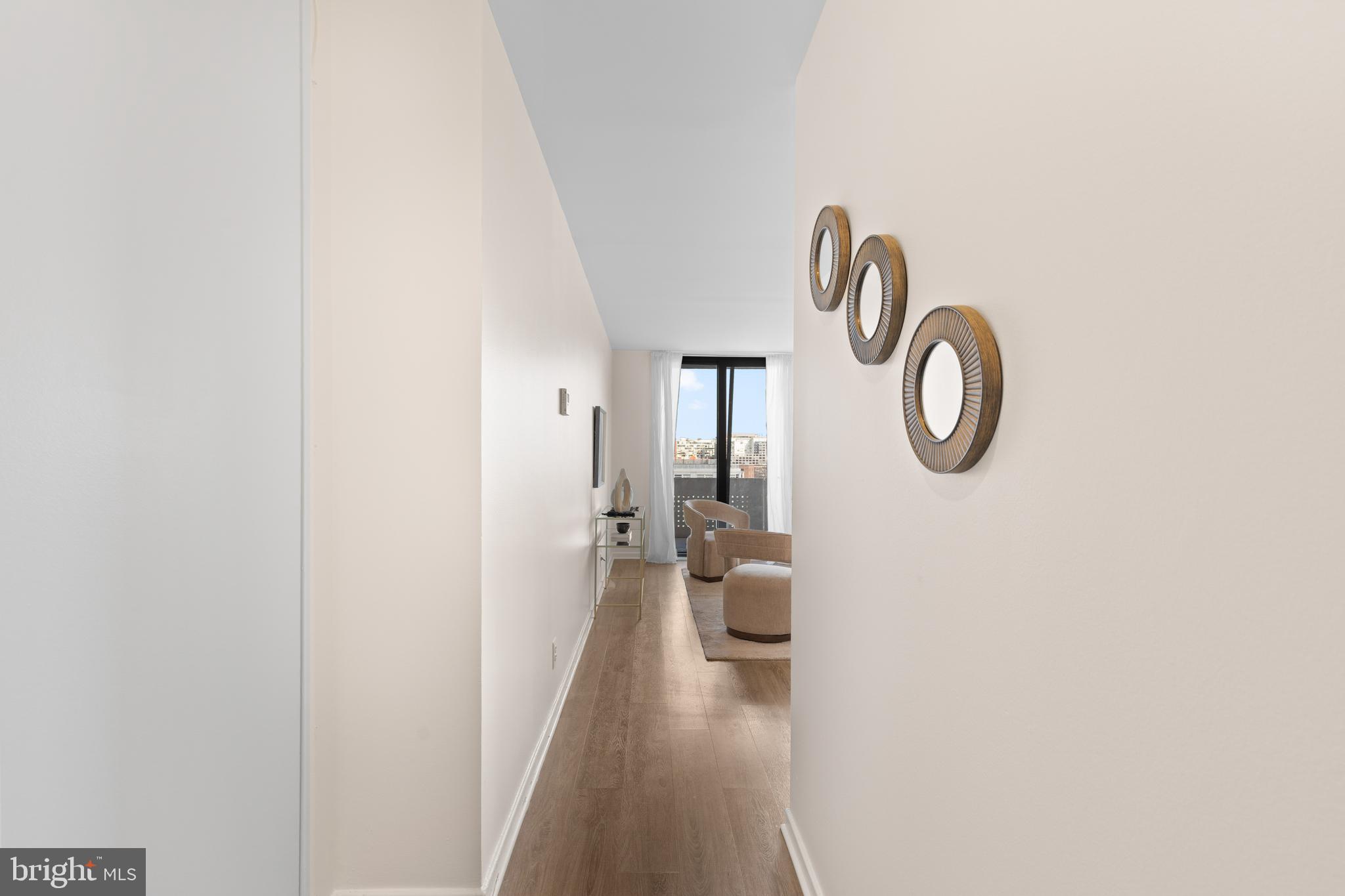 300 M Street Southwest, Unit N808 Washington, DC 20024 - Photo 3 of 36 a view of a hallway with a washer and dryer