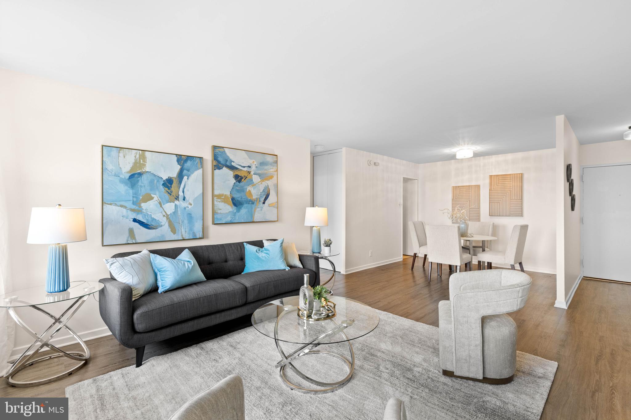 300 M Street Southwest, Unit N808 Washington, DC 20024 - Photo 5 of 36 a living room with furniture and wooden floor