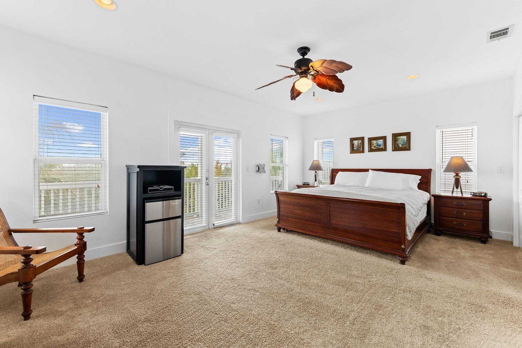 150 Cottage Way, Unit 20 Inlet Beach, FL 32461 - Photo 16 of 38 a bedroom with a bed and wooden floor
