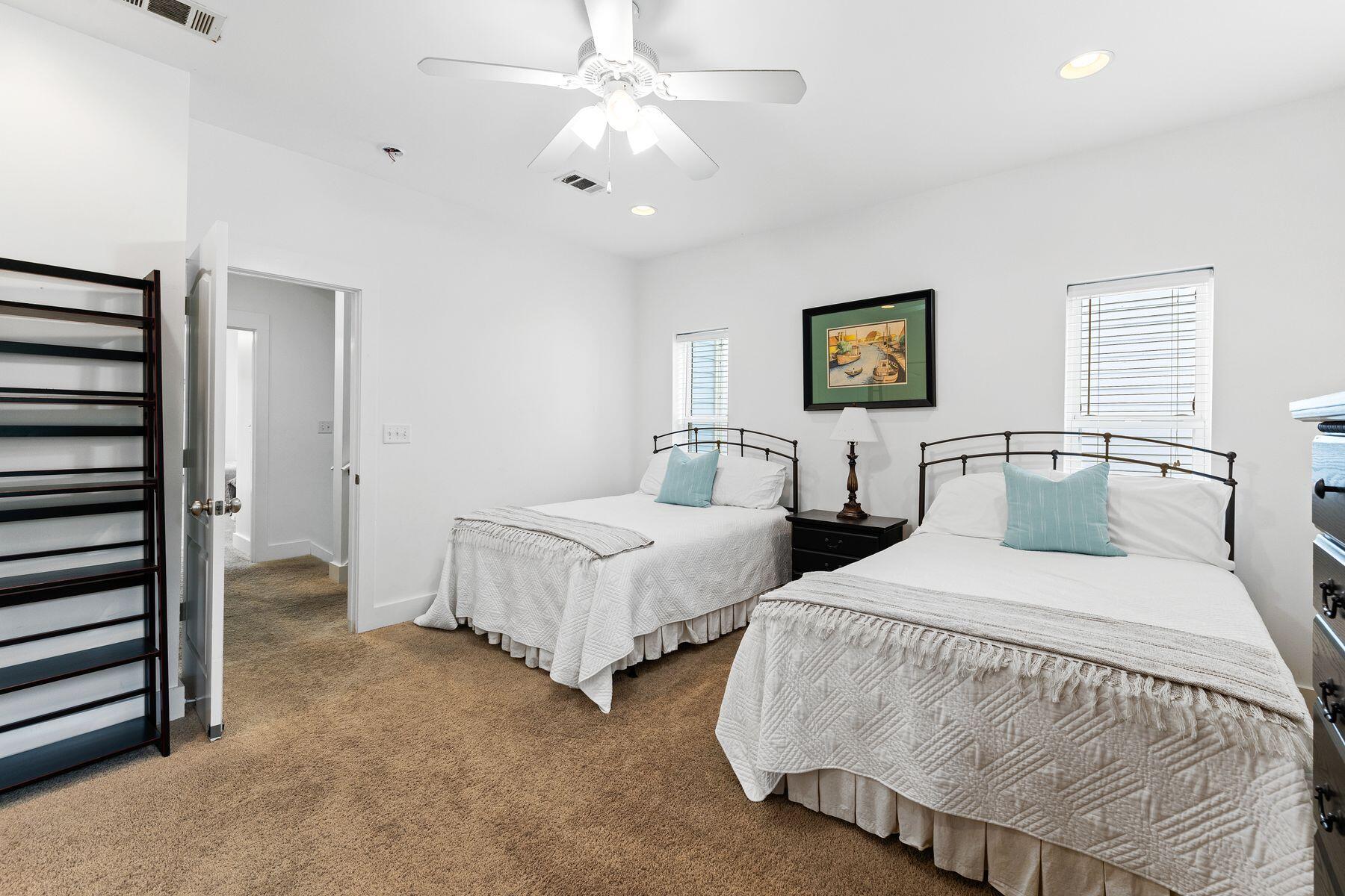 150 Cottage Way, Unit 20 Inlet Beach, FL 32461 - Photo 22 of 38 a bedroom with two beds and a ceiling fan