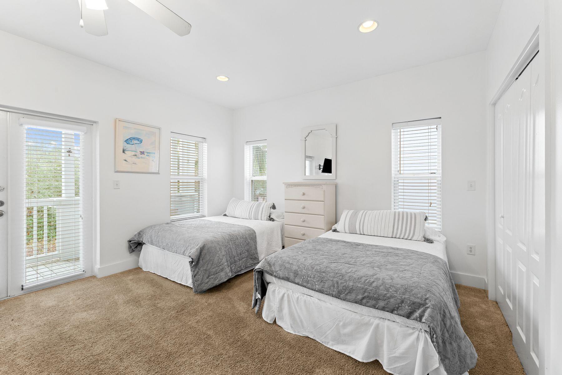 150 Cottage Way, Unit 20 Inlet Beach, FL 32461 - Photo 27 of 38 a spacious bedroom with two beds and a large window