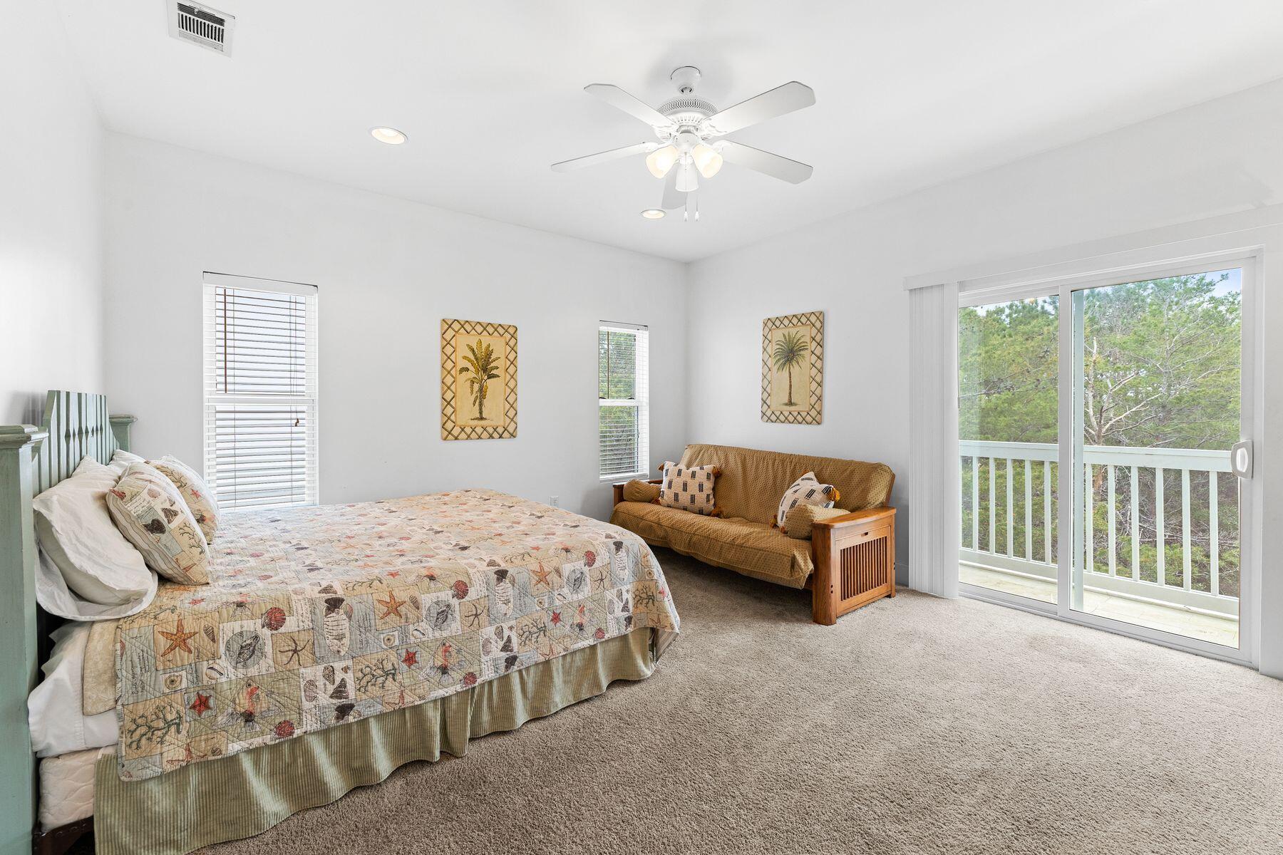 150 Cottage Way, Unit 20 Inlet Beach, FL 32461 - Photo 32 of 38 a bedroom with a bed a couch and a large window