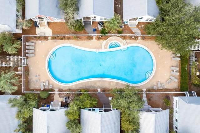 an aerial view of a house with swimming pool