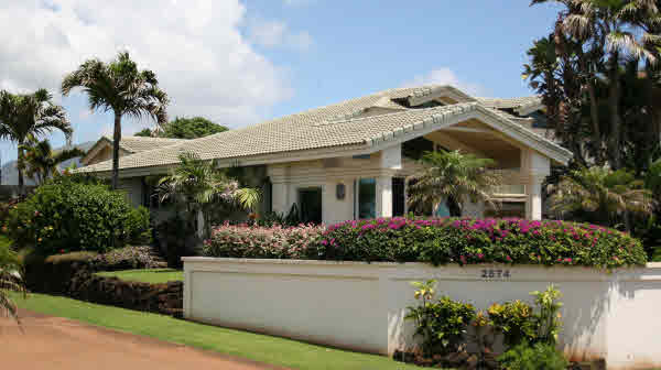 2574 Hoonani Road Koloa, HI 96756 - Photo 10 of 12 a front view of a house with a flower garden