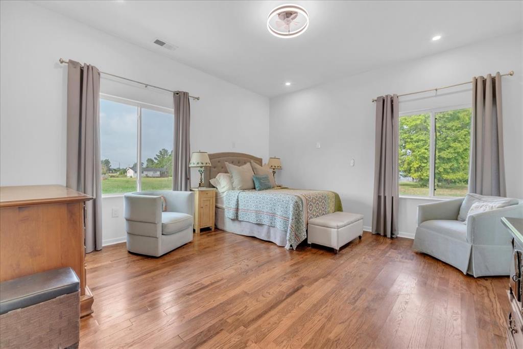 4120 Benjamin Road Caney City, TX 75148 - Photo 19 of 36 Spacious room featuring wood-finish flooring and white walls